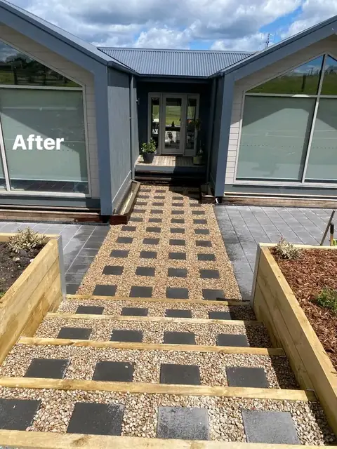 Landscaped yard with timber retaining walls, merbau deck and charcoal paving (2 of 8)