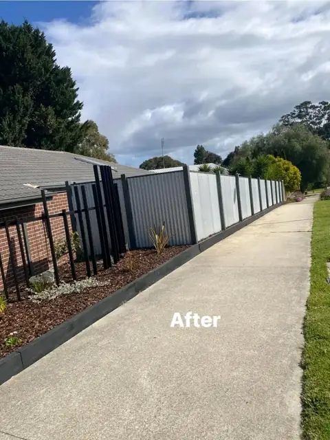 Paved side yard with yuccas, timber edging and garden beds (6 of 9)