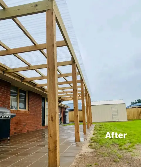 Timber pergola over a paved area beside a brick home (2 of 4)