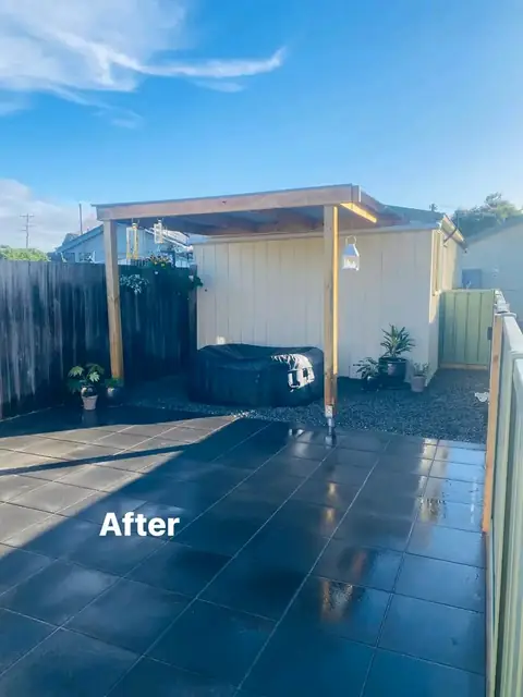 Refreshed yard with pergola, charcoal paving and mulched garden beds