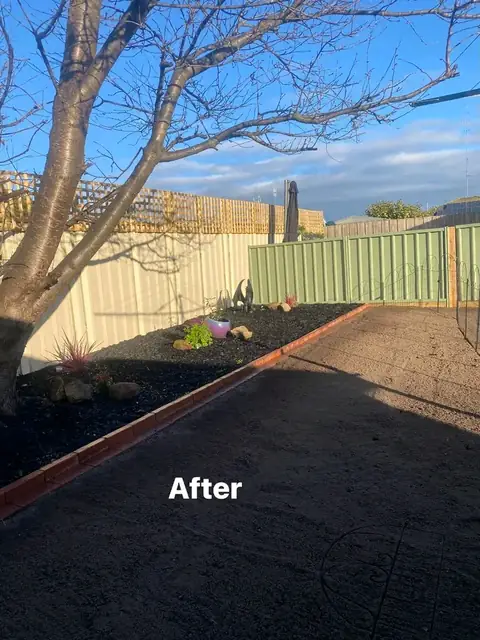 Refreshed yard with pergola, charcoal paving and mulched garden beds (2 of 8)