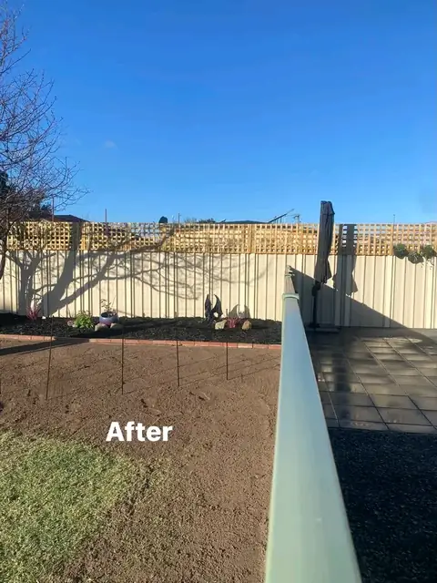 Refreshed yard with pergola, charcoal paving and mulched garden beds (4 of 8)