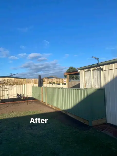 Refreshed yard with pergola, charcoal paving and mulched garden beds (5 of 8)